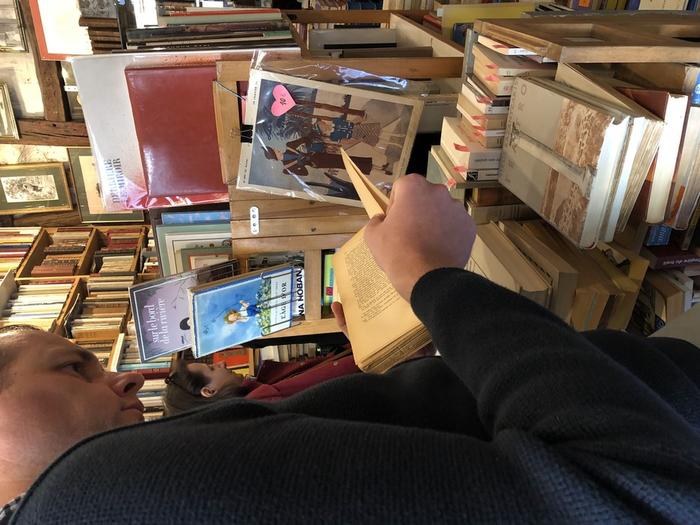 "Paris: Checking first editions of French translations and tracing special editions of Nikos Kazantzakis in a specialised antiquarian bookshop", Bart Soethaert, Research Area 5 "Building Digital Communities" | Image Credit: Bart Soethaert